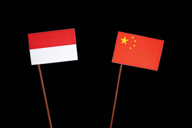 istock Indonesian flag with Chinese flag isolated on black background 694351146