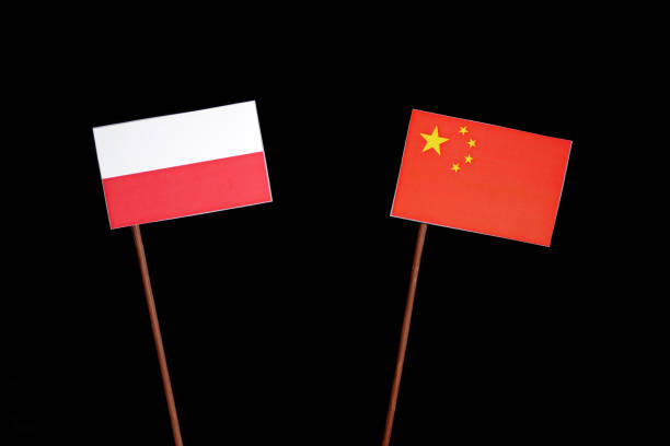 istock Polish flag with Chinese flag isolated on black background 694351374