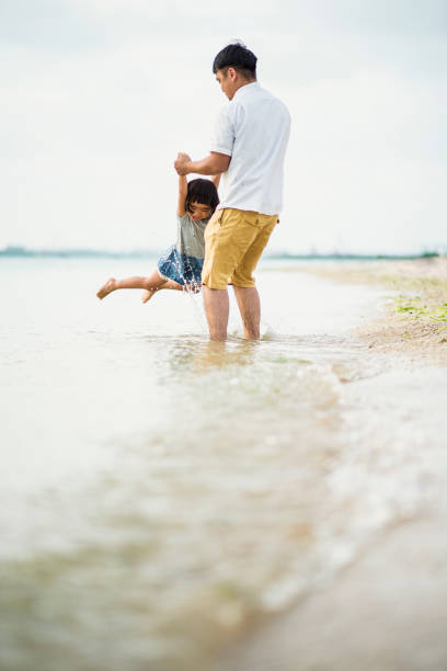 Happy family having a good time in beach.