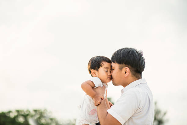 istock Father and son playing on the beach 694351538