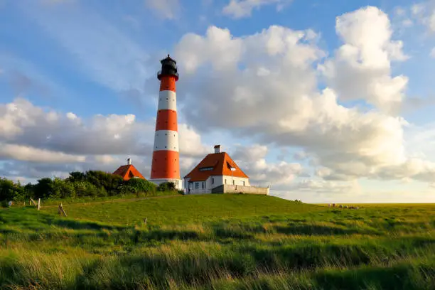 The most famous German lighthouse situated in Westerheversand at sunset.