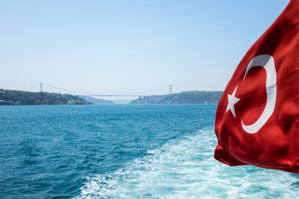 istock Turkish flag on ship with the background of Istanbul Bosphorus 694354992