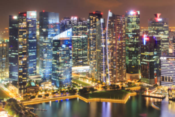 istock Blurred abstract background lights, beautiful singapore skyline view 694355056