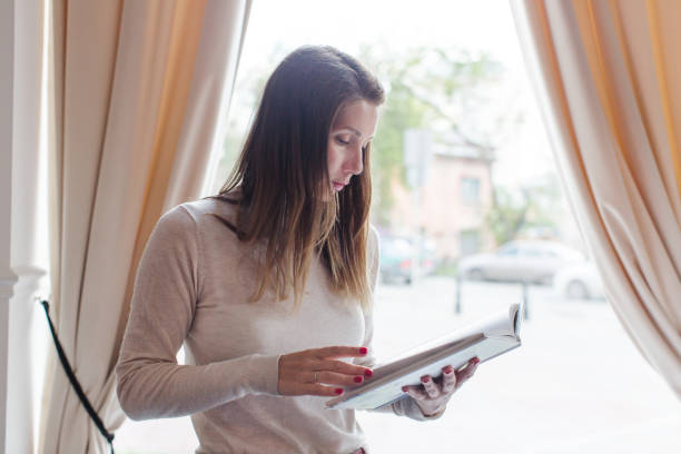 istock Casual woman with book 694360966