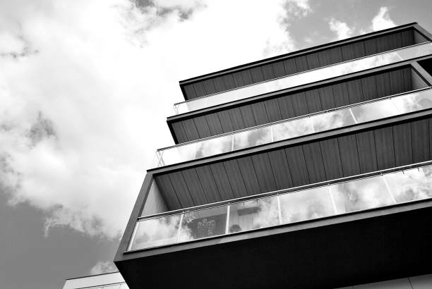 istock Modern apartment building exterior. Black and white 694361056
