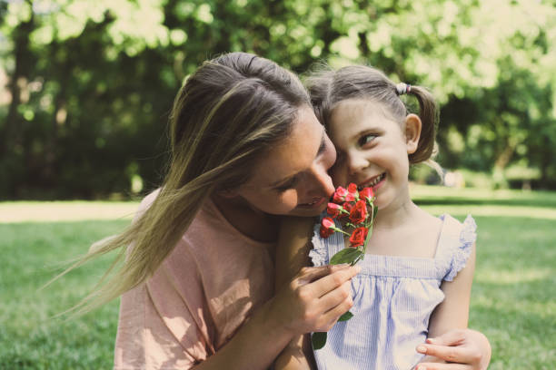 istock Daughter chose a flower to his mother. 694363816