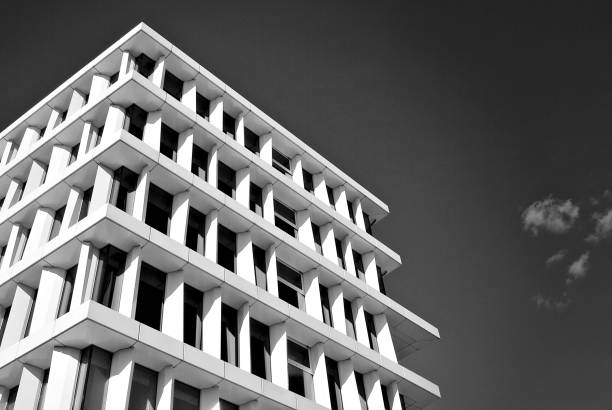 istock Modern building. Modern office building with facade of glass. Black and white 694364268