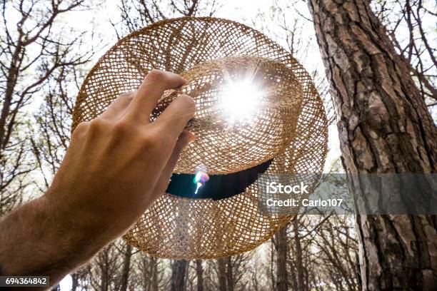 Woman Holding A Straw Hat Stock Photo - Download Image Now - Beauty, Beauty In Nature, Blue