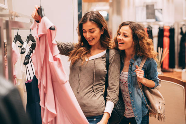 istock Two friends shopping for clothes 694364866