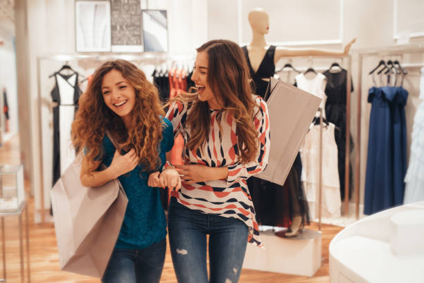 istock Two friends shopping for clothes 694364868