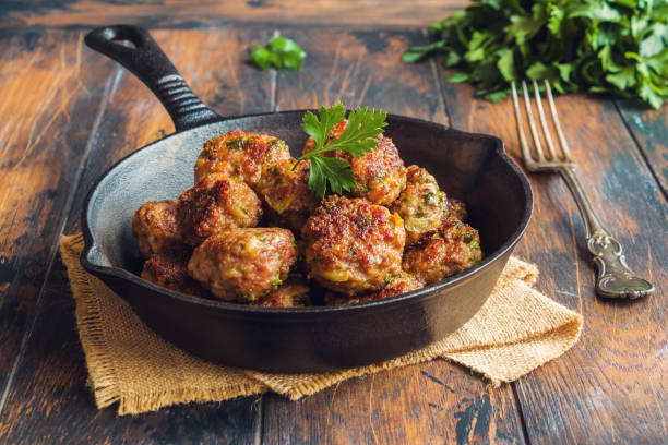 istock Homemade roasted beef meatballs in cast-iron pan. 694367602