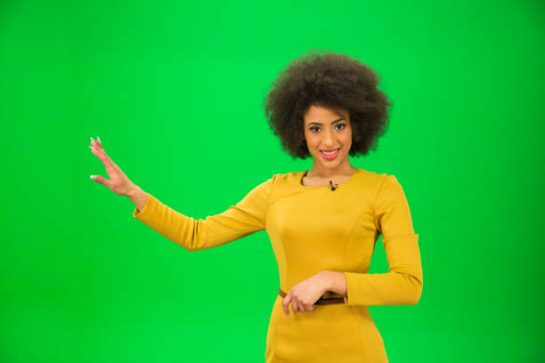 istock Journalist against green background 694375374