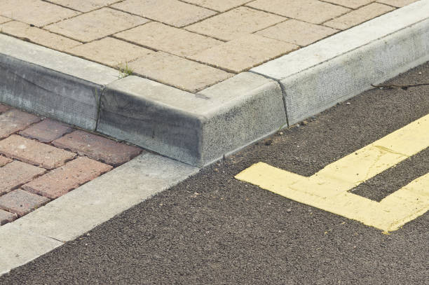 kerb, sidewalk, double yellow line Tiled walkway in England, with double-yellow lines pavement ends sign stock pictures, royalty-free photos & images