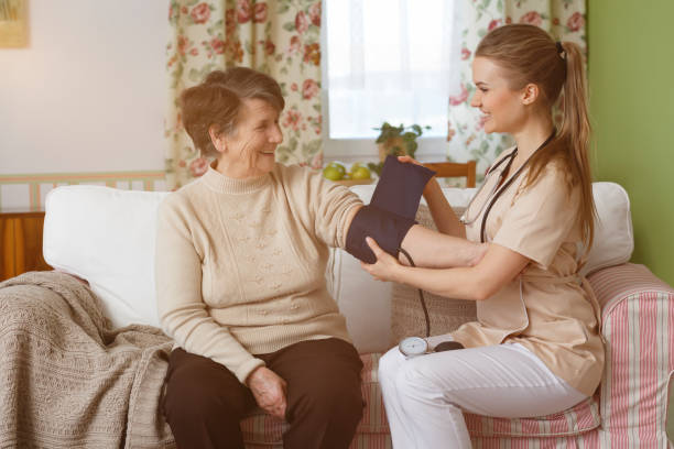 istock Nurse measuring blood pressure 694375934