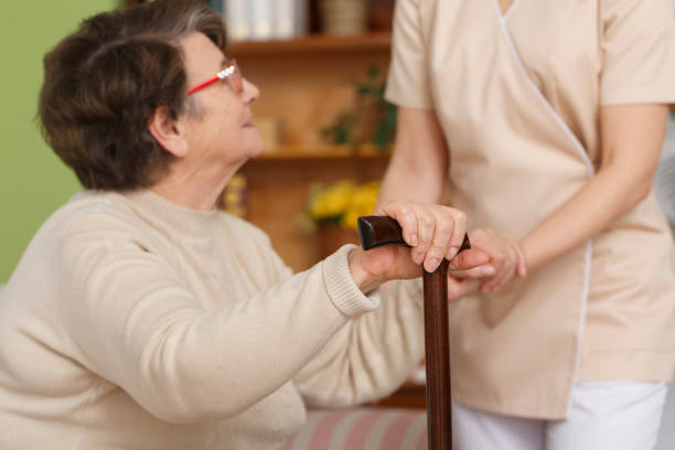 istock Elderly woman trying to stand up 694375936
