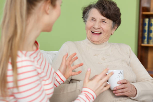 istock Granddaughter and grandma laughing 694376000