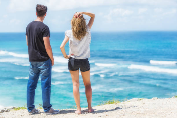 istock Couple enjoying the view on a tropical beach. 694379882