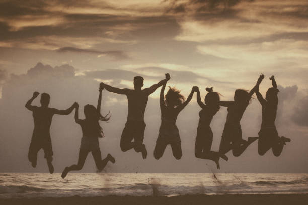 istock Summer vacation with friends: beach party at sunset 694382306