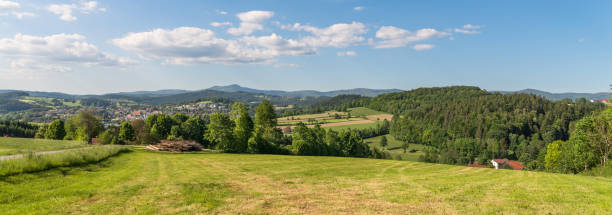 Panorama view of Grafenau in the bavarian forest with mountains small and big Rachel and mountain Lusen Panorama view of Grafenau in the bavarian forest with mountains small and big Rachel and mountain Lusen bavarian forest stock pictures, royalty-free photos & images