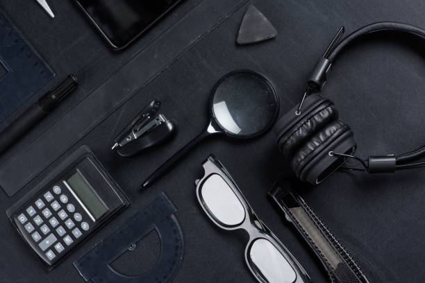 istock various office supplies with headphones mock-up isolated on black 694388544
