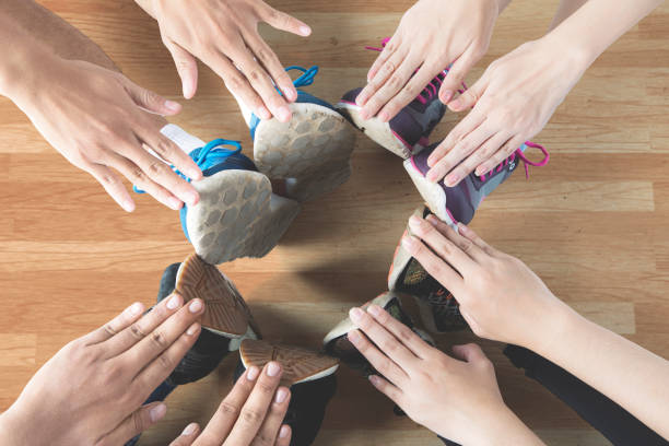 istock Athletes make circle with hands and feet 694388776