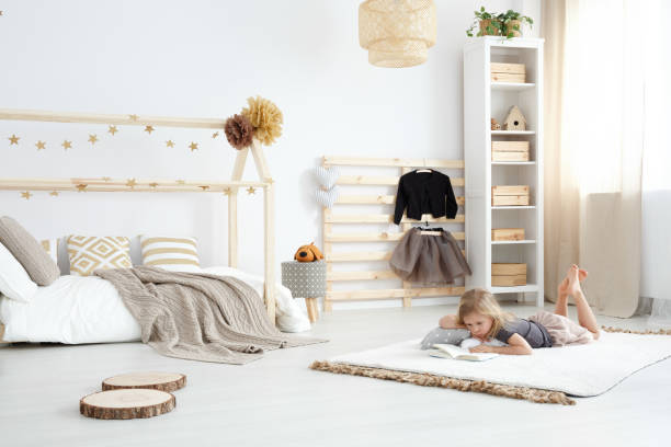 White spacious dreamy bedroom Girl playing in white spacious dreamy bedroom in scandinavian style nordic walking pole stock pictures, royalty-free photos & images
