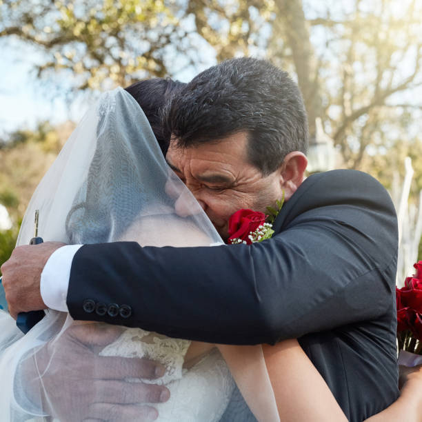 Embracing the beauty and joy of the day Cropped shot of a father hugging his daughter on her wedding day bride hugging father on wedding day stock pictures, royalty-free photos & images