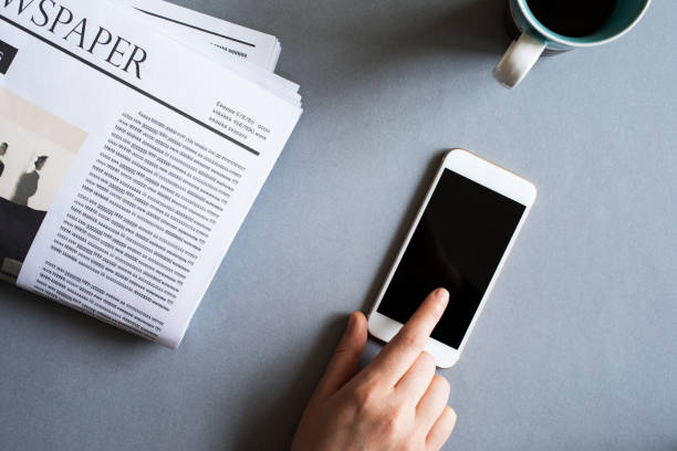 istock Businesswoman using mobile phone on desk 694402690