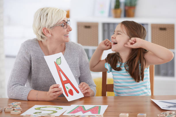 istock Girl smiling to her therapist 694402972