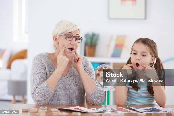 Proper Articulation Therapy For Girl Stock Photo - Download Image Now - Speech Therapy, Child, Psychotherapy