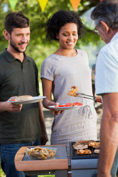 istock Couple at family picnic 694418932
