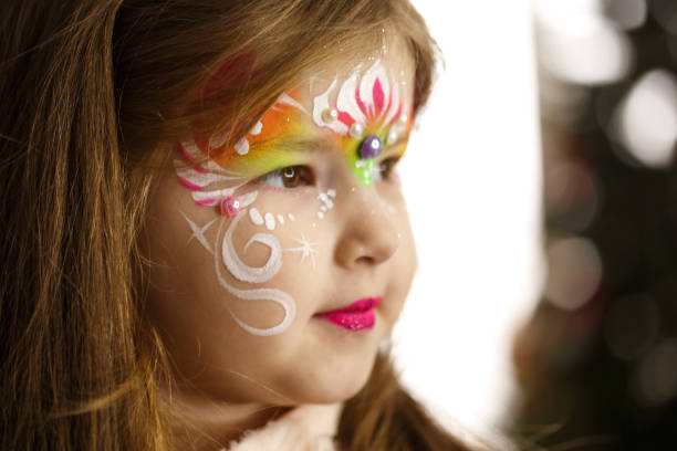 istock Little girl with face paint 694419148