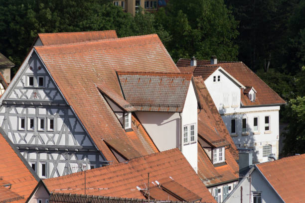 istock roofs on wooden framework in city 694419620