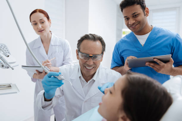 istock Interested in process students looking at girl 694422348
