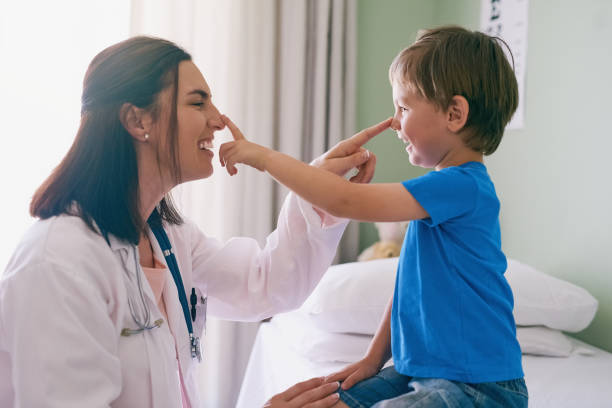 Personality is as important as knowledge and expertise Shot of a little boy visiting the doctor pediatrician stock pictures, royalty-free photos & images
