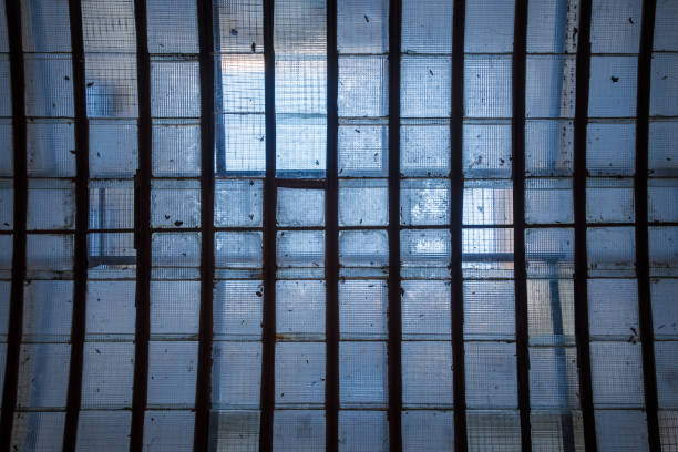 istock Skylight in ceiling with reinforced wire meshed glass sun illuminated 694432528