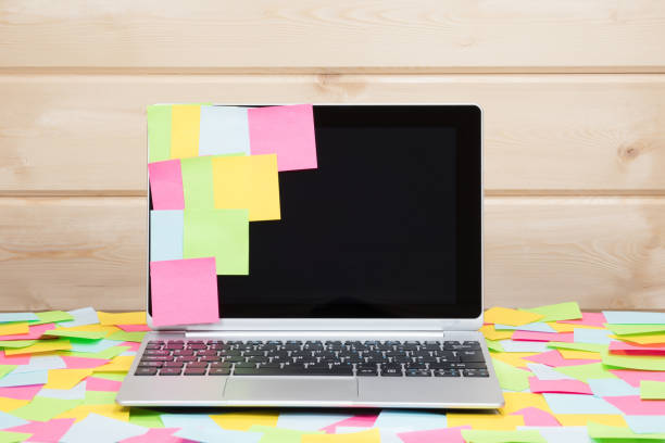 istock Colorful sticky notes stuck to a laptop screen 694433008