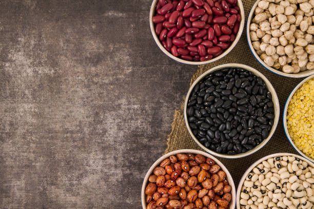 istock Legumes and Beans in Small Bowls 694433054