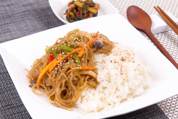istock Rice with Stir-fried Glass Noodles and Vegetables - Japchae Bap 694433202