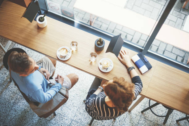 istock Man and woman drinking coffee 694433284