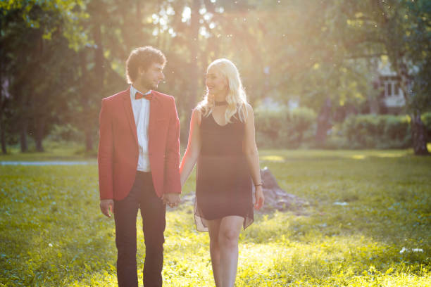 istock Cute couple walking in nature 694433360