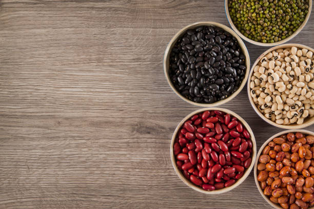 istock Legumes and Beans on Wooden background 694443322