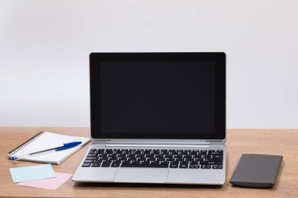istock Office desk with laptop and mobile phone 694443854