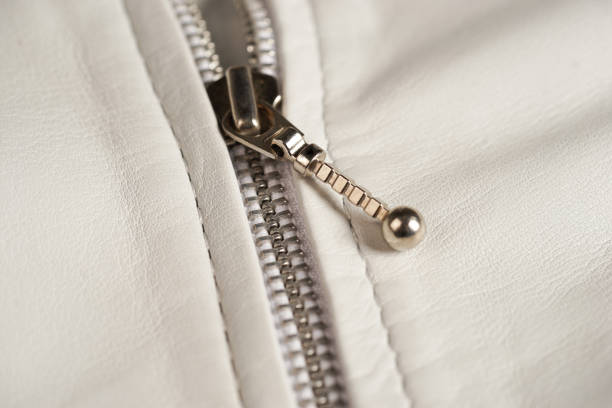 istock White leather jacket zipper. Macro details 694444262