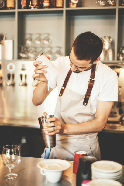 istock Professional barista making coffee in cafe bar 694447660