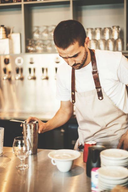istock Professional barista making coffee in cafe bar 694447662