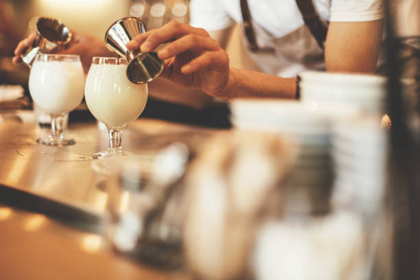 istock Barista adding flavor to latte coffee 694447684