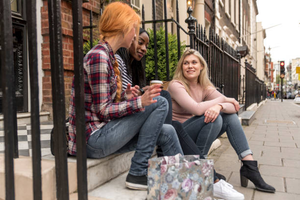 istock Friends sitting  on the steps 694450238