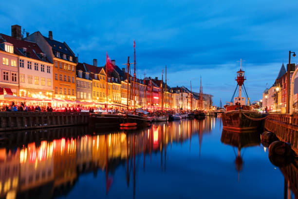 istock Summer sunset in Nyhaven, Copenhagen 694451158