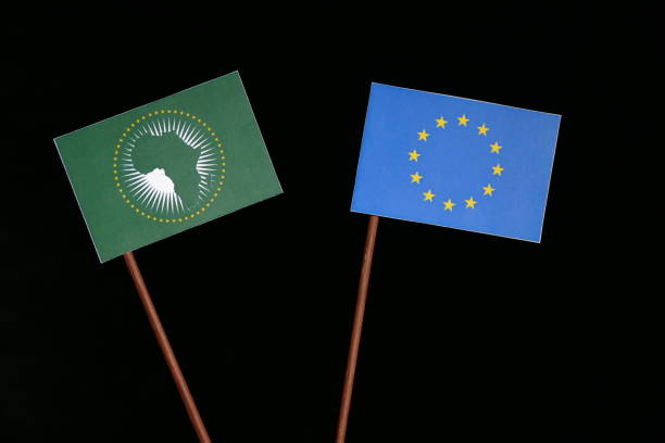 EU flag with African Union flag isolated on black background stock photo